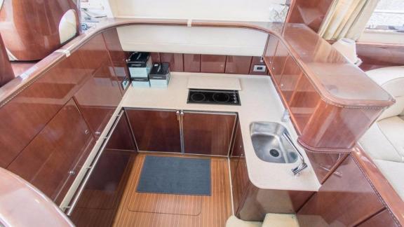 The kitchen area of the motor yacht Hadron features modern appliances.